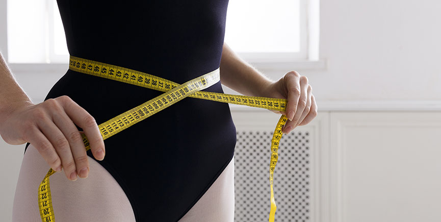 Beautiful ballerine torso with measuring tape, slim waist after diet
