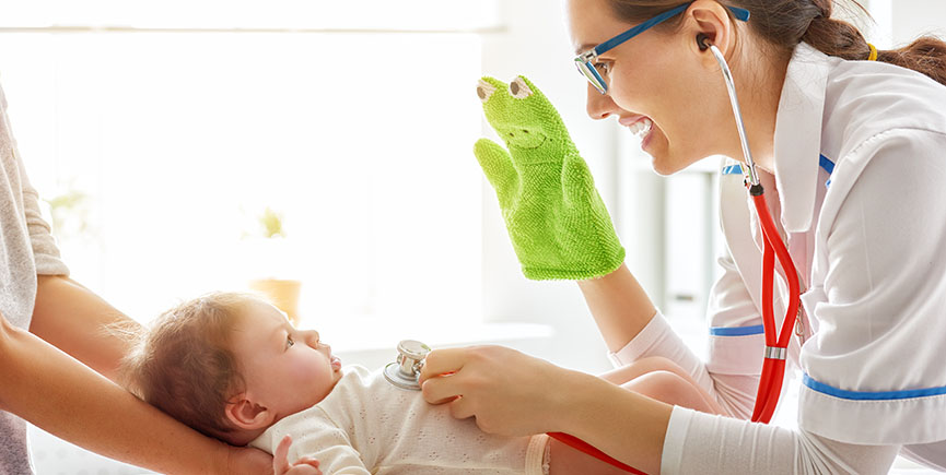 doctor examining a baby