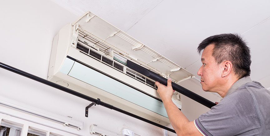 Series of technician servicing the indoor air-conditioning unit.